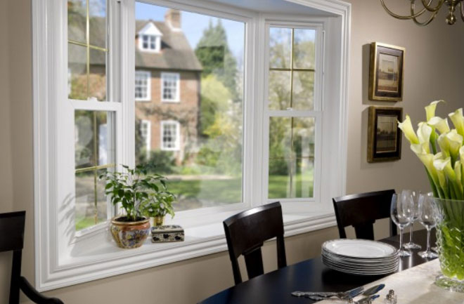 Beautiful bay windows with white trim by HomeStar Builders